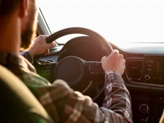 ahl man driving with his girlfriend