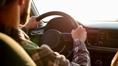 ahl man driving with his girlfriend
