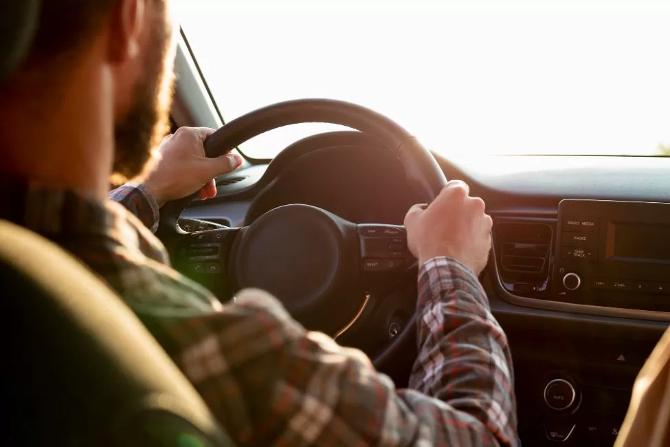 ahl man driving with his girlfriend